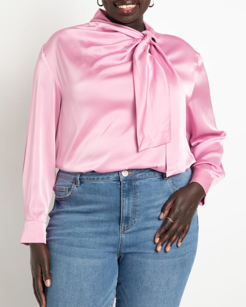 Front of a model wearing a size 14 Kat Drop Shoulder Tie Neck Blouse in Foxglove by ELOQUII. | dia_product_style_image_id:236718